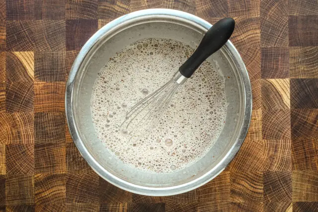 Whisked custard mixture for the French toast casserole.