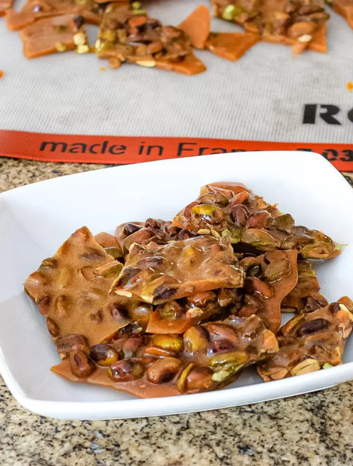 broken pistachio brittle in a serving dish