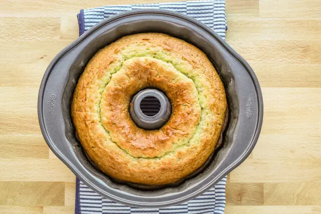 Baked pistachio Bundt cake in the pan.