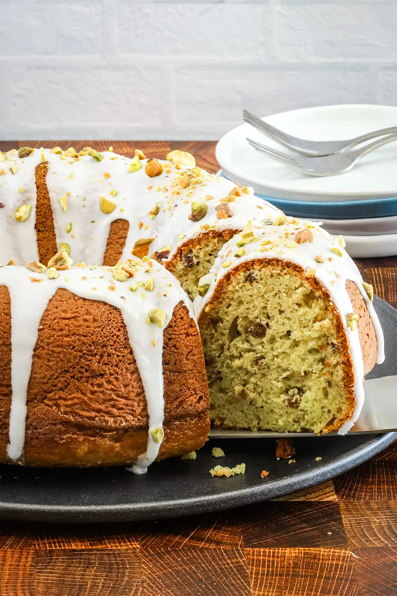 Moist pistachio cake made with a cake mix, pudding, and pistachios.