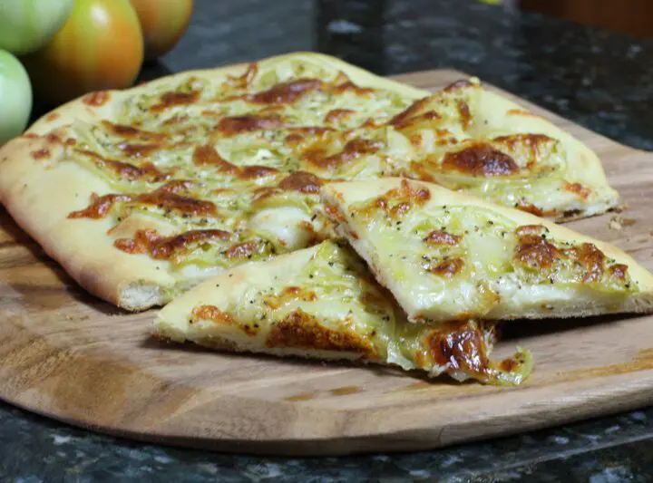 buttermilk pizza crust shown with green tomato pizza