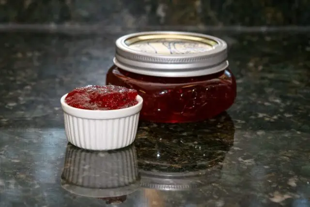 plum and peach jam in a canning jar