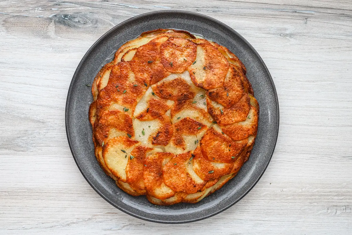 Pommes Anna flipped onto a serving plate.