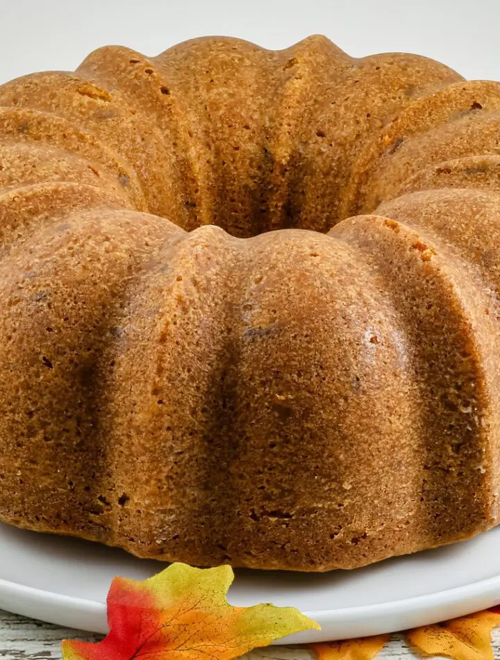 A brown sugar and pecan pound cake on a cake platter.