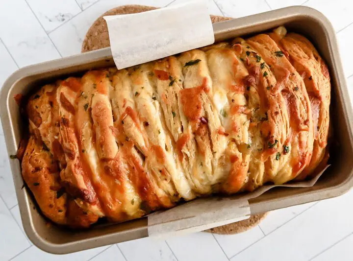 cheese and garlic pull apart bread baked with biscuits