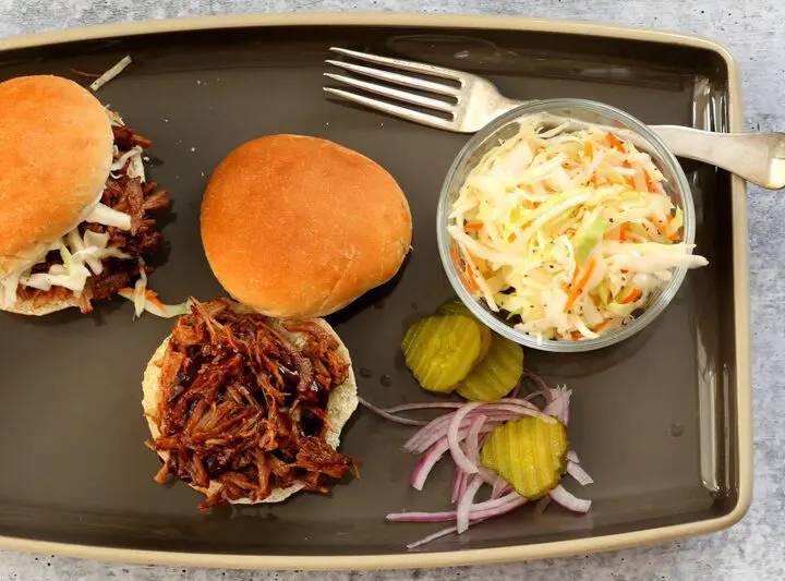 pulled pork sandwiches with coleslaw on the side