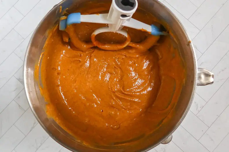 mixing the pumpkin cake batter