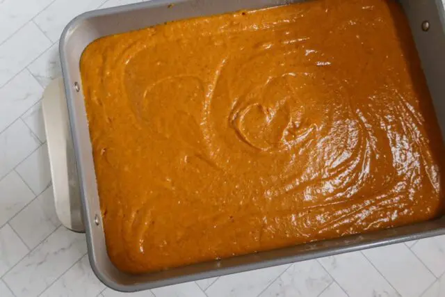 pumpkin cake batter in the pan