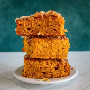 Slices of pumpkin cake with broiled coconut pecan topping