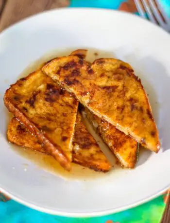 pumpkin french toast on a plate with maple syrup