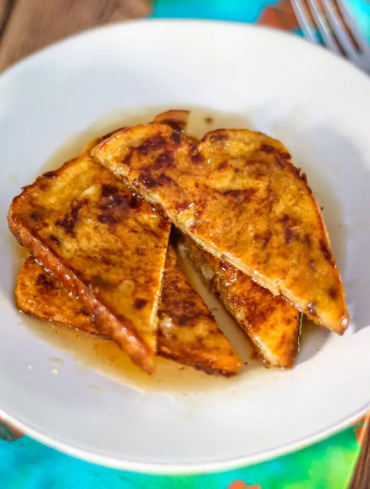 pumpkin french toast on a plate with maple syrup