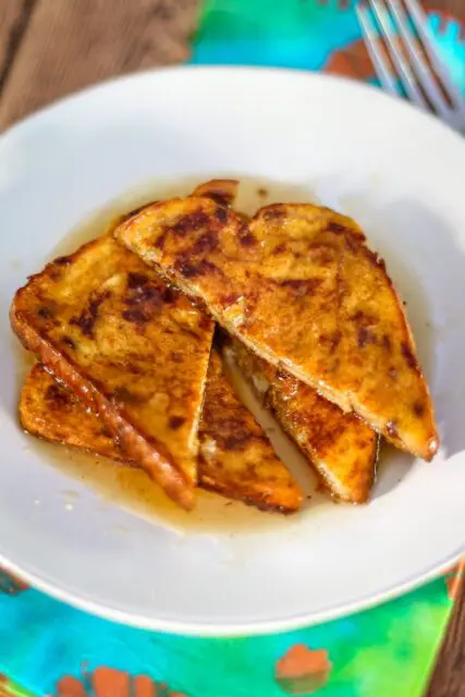 pumpkin french toast on a plate with maple syrup