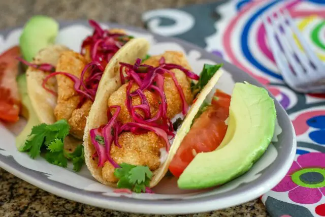 purple slaw on homemade fish tacos