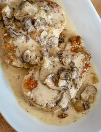 ranch pork chops with sauce on a platter