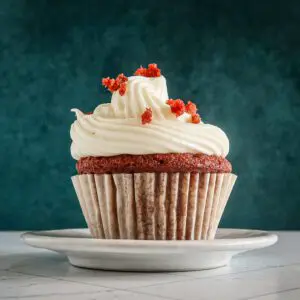 a red velvet cupcake on a small plate