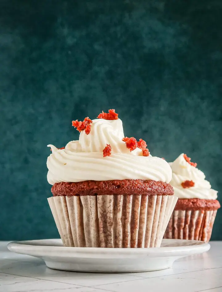 A red velvet cupcake with another one in the background