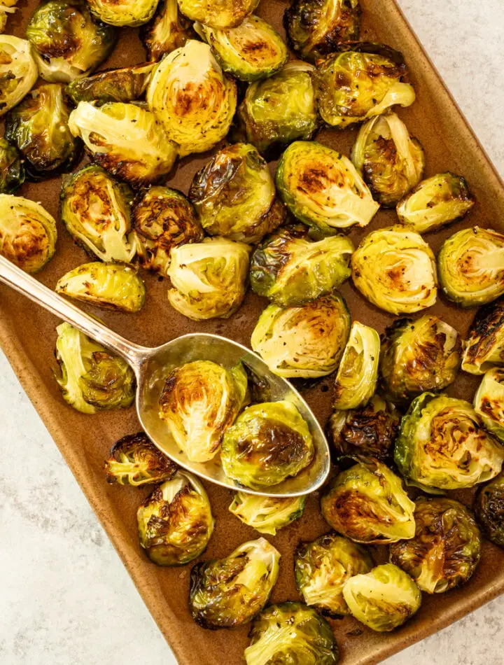 Roasted Brussels sprouts on a serving tray.