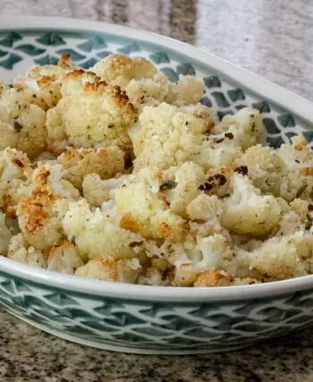 roasted cauliflower with lemon in a serving dish
