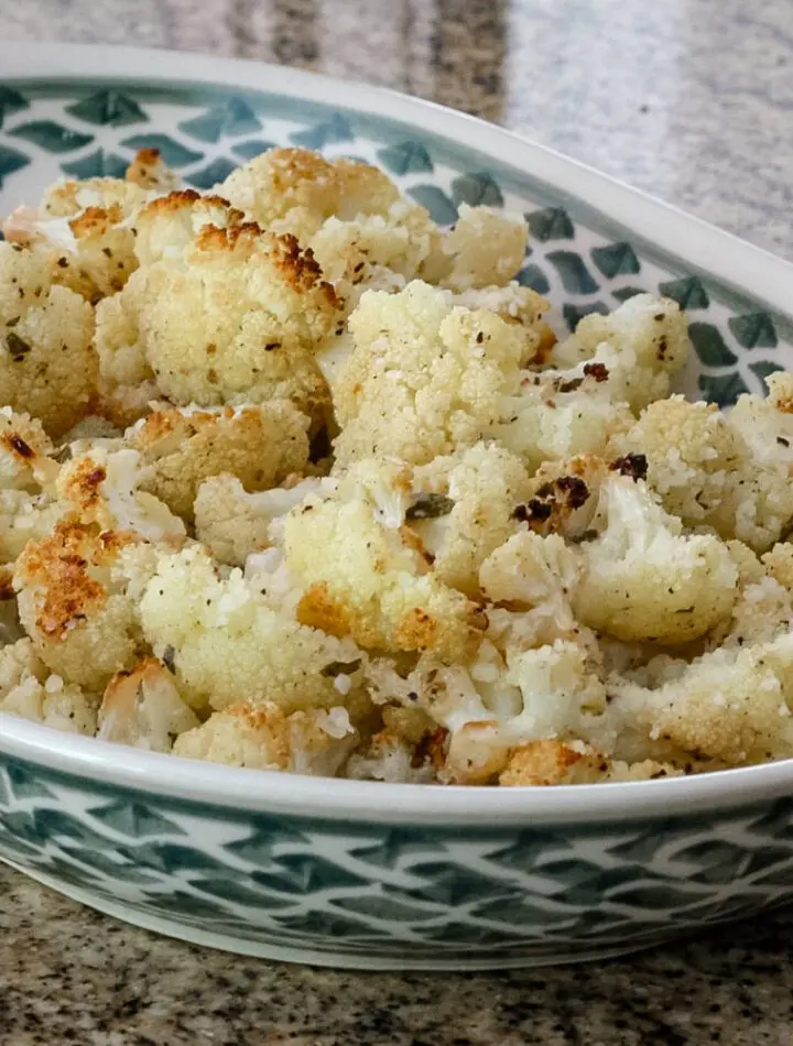 roasted cauliflower with lemon in a serving dish