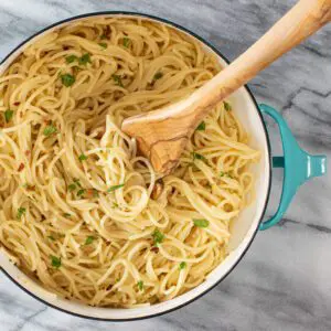 roasted garlic pasta in the pan with some parsley