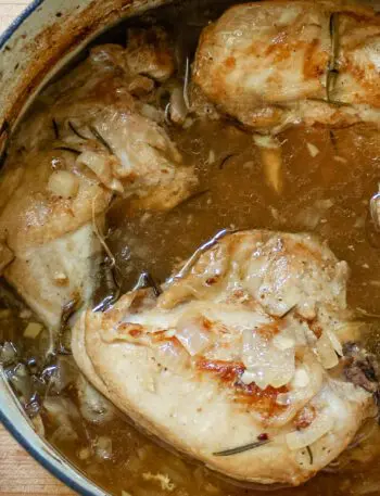 braised chicken with rosemary in a dutch oven