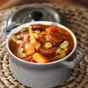 a small cocotte with smoked sausage and butternut squash stew