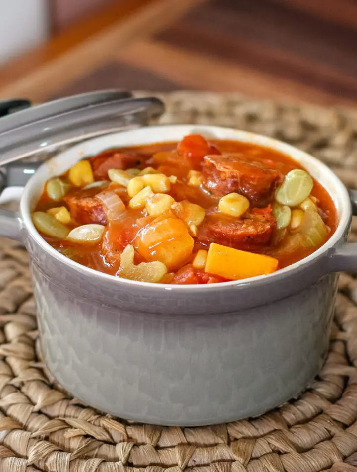 sausage and butternut squash stew with tomatoes and corn in a serving size cocotte