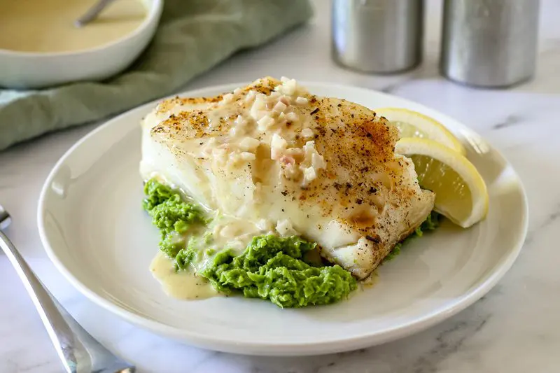 chilean sea bass with lemon and beurre blanc sauce on pea puree