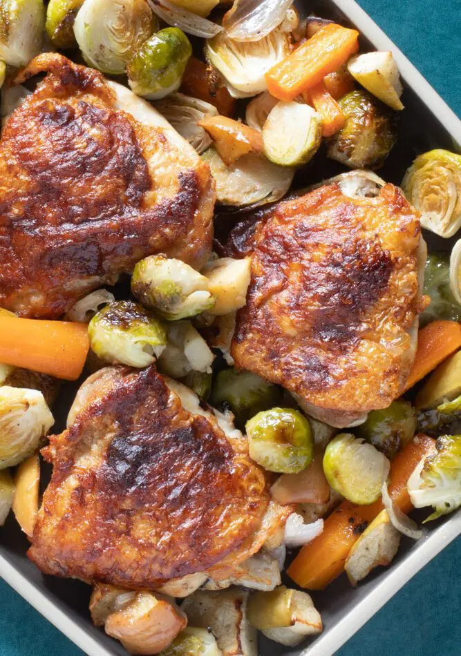 roasted chicken thighs with brussels sprouts and apples and carrots