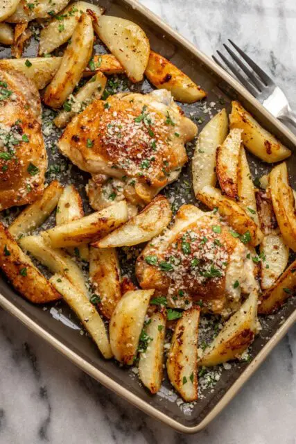 sheet pan garlic and parmesan chicken thighs with potatoes