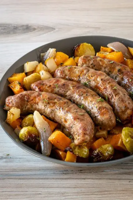 sheet pan sausages with autumn vegetables and pears