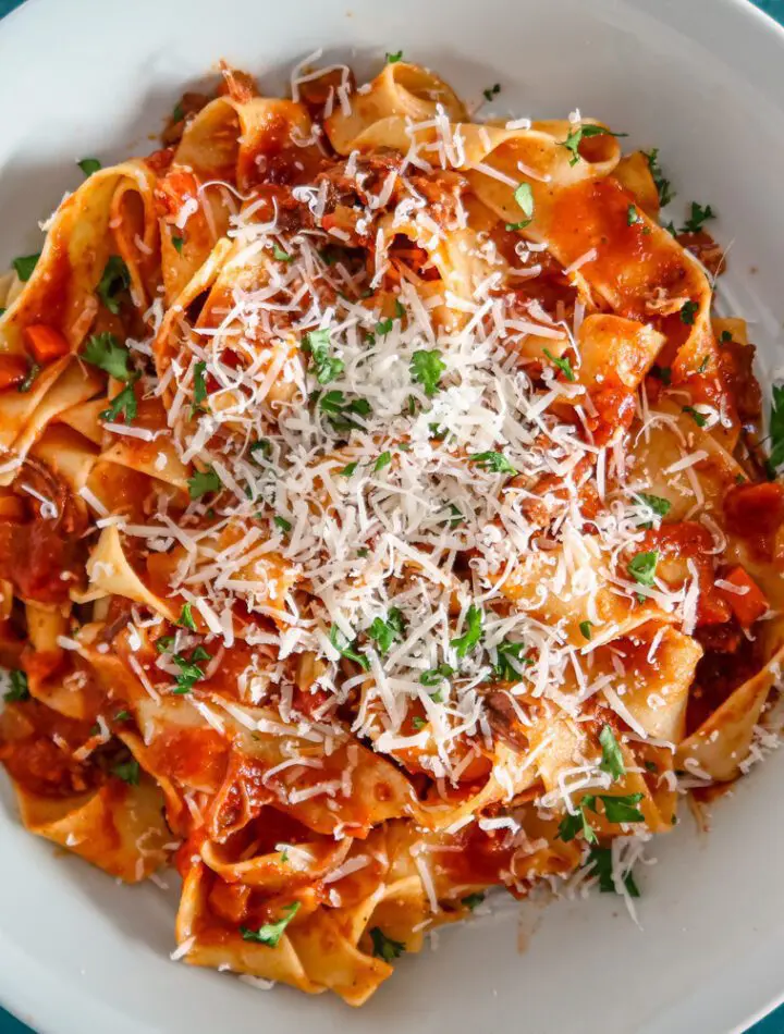 short rib bolognese sauce with pasta and parmesan