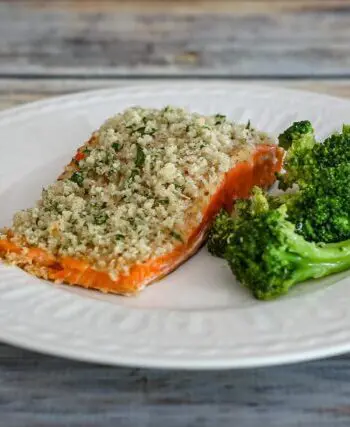 broccoli with lemon shown with a salmon fillet on a plate
