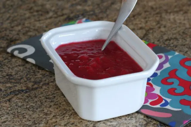 A serving container with rhubarb compote