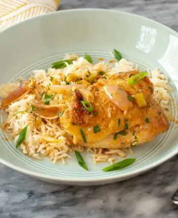 easy harissa chicken skillet shown with rice
