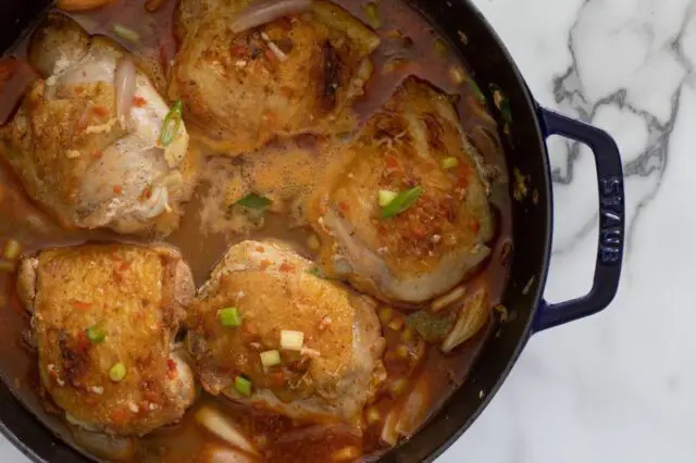 The remaining ingredients are combined to make a sauce and the chicken is added back to the pan to cook for 20 minutes longer