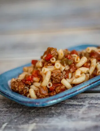 macaroni and ground beef on a small plate