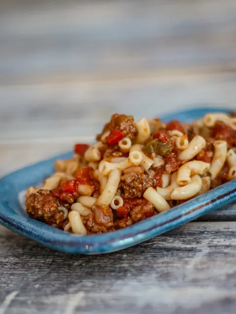 macaroni and ground beef on a small plate