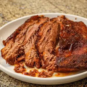 sliced slow cooker brisket on a plate