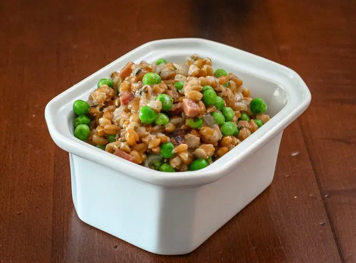 slow cooker farro pilaf in a serving dish