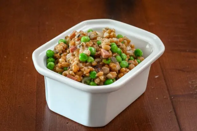 slow cooker farro pilaf in a serving dish