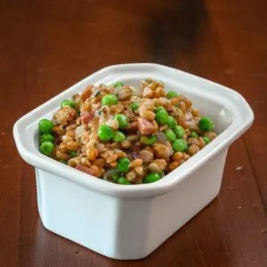 slow cooker farro pilaf in a serving dish