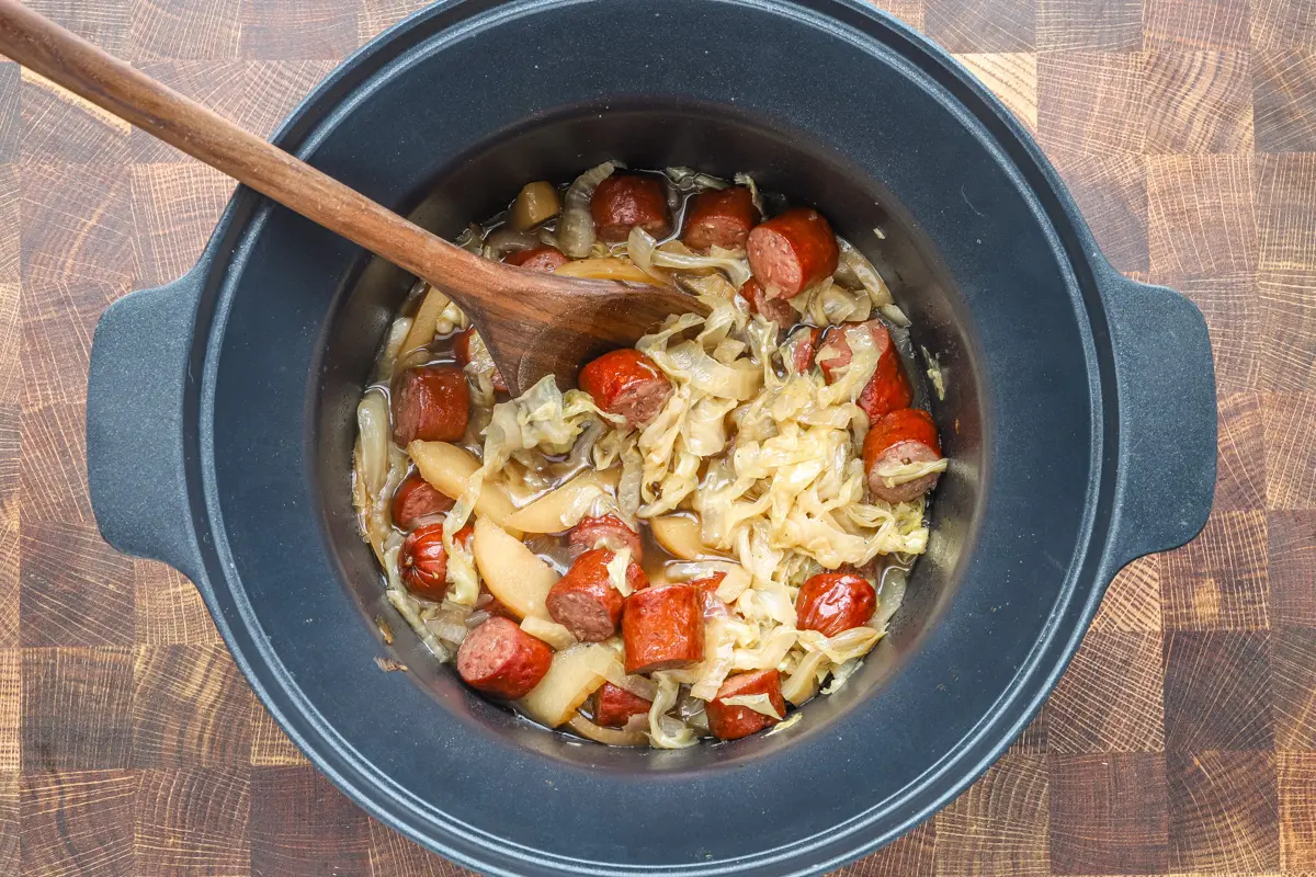 An overhead view of the kielbasa, cabbage, and apple slow cooker meal.