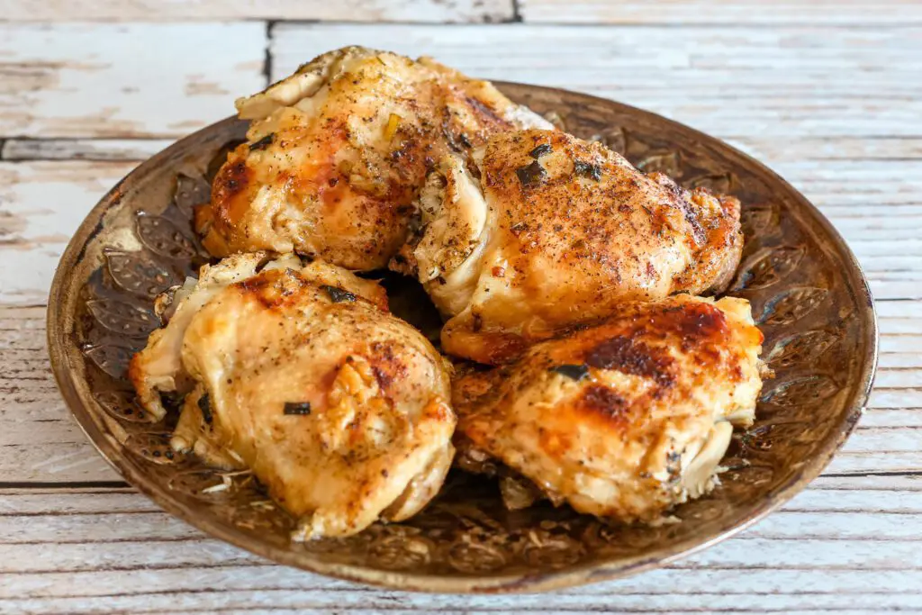 slow cooker chicken thigs arranged on a plate