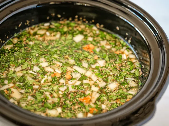 slow cooker with lentil soup ready to cook