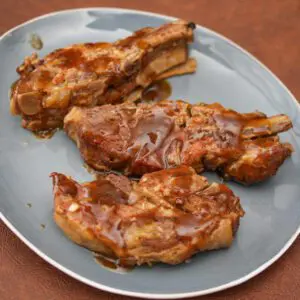 slow cooker spareribs with marmalade sauce on a serving plate