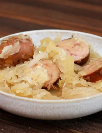 smoked sausages, sauerkraut, and apple meal in a bowl, cooked in the slow cooker