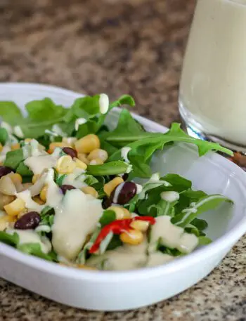 sour cream dressing on a small salad