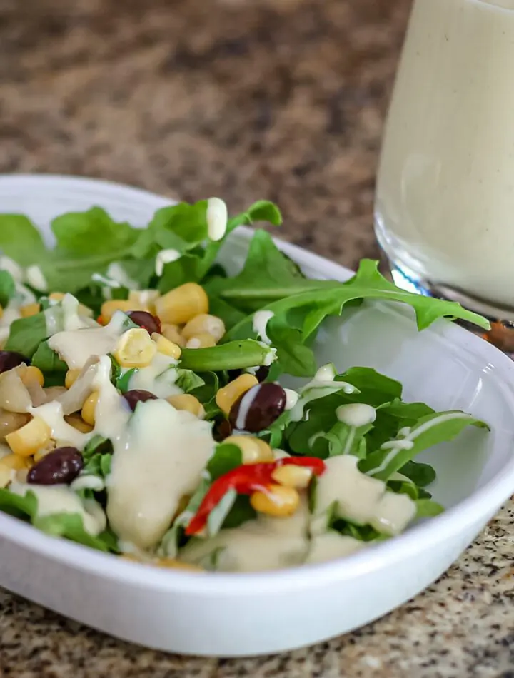 sour cream dressing on a small salad