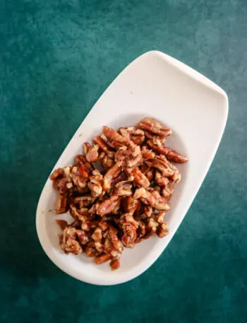 small dish with spiced pecans